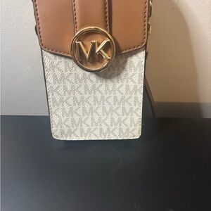 Michael Kors Tan and Cream Crossbody Bag new never used. Will hold a iPhone plus